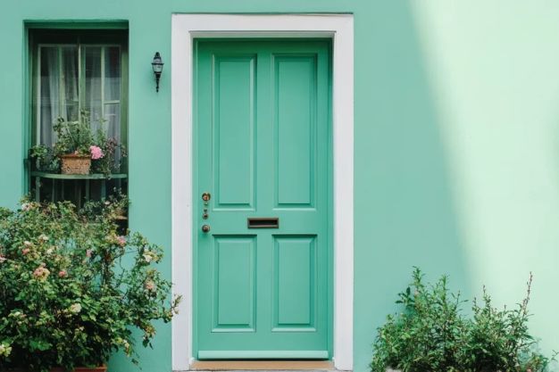 White-framed sliding doors with a pop of mint green