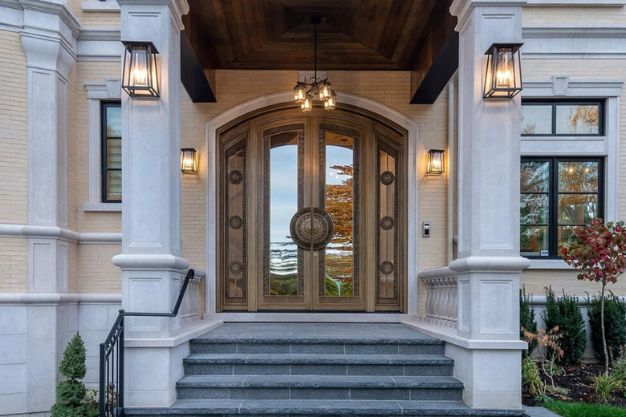 An arched main door entrance design for flats